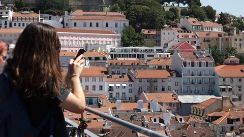 Tourist Using Smartphone In Lisbon Rooftop Видео 115699855