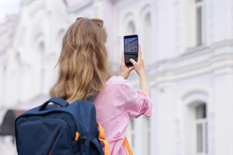 Tourist using smartphone to recognize historic building with AI app Stock Photos