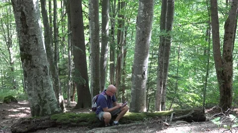 Tourist Using Touch Tablet Checking Weather Site Mountain Area Temperatures Video stock 42088207