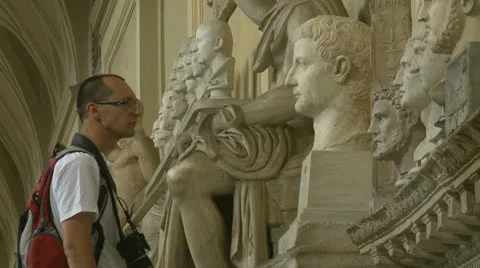 Tourist viewing statues at the Vatican Stock Footage