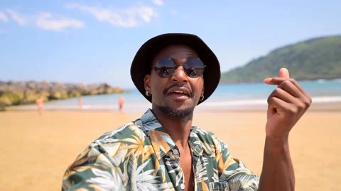 Tourist vlogging on tropical beach, sharing summer vibes Stock Footage 310523435