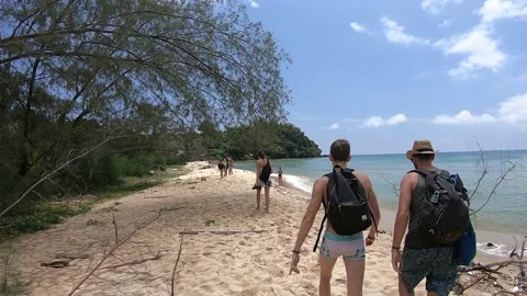 Tourist Walking to the island Stock Footage