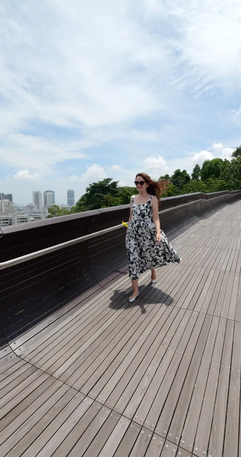 Tourist walking on pedestrian bridge, explore nature parks at Singapore Stock Footage 306576741