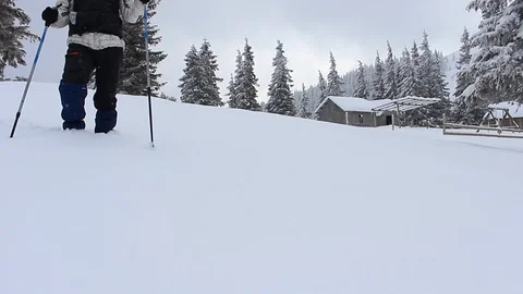Tourist walking in the snow Stock Footage 86680846