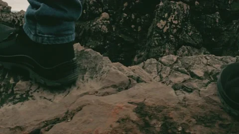 Tourist walks forward on sharp stones Stock Footage 228648381