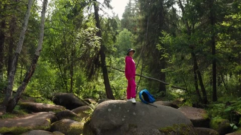 A tourist walks through the forest Stock Footage 171265402