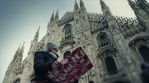 Tourist watching the map in front of Milan Dome Stock Footage 18519640