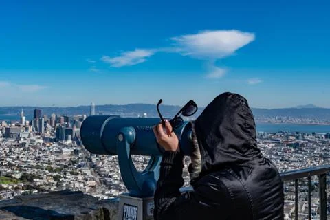 A tourist while looking at the Point of view telescope at Viewpoint Twin Peak Stock Photos