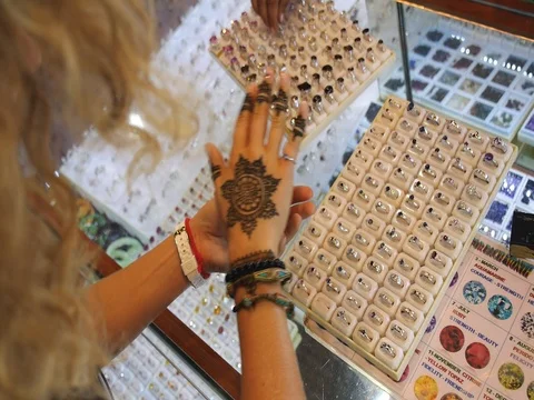 Tourist Woman Choosing Ring On Jewelery Market Stock Footage