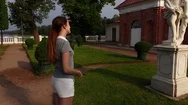 Tourist Woman Feast Eyes With Antique Sculpture At Formal Garden, Take Photo Stock Footage