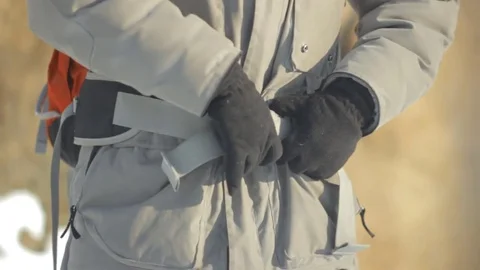 A tourist zips up backpack Video stock 83674216