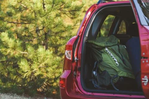 Touristic backpack in car back close up Stock Photos