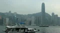 Touristic Boat Passing in Victoria Port Hong Kong Skyline Skyscrapers Landmarks HD Footage