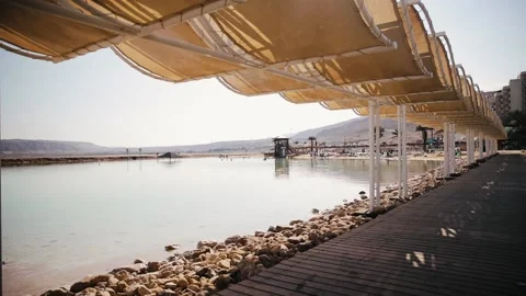 Touristic place on the sea beach at Ein Bokek, Israel. Shore of the Dead Sea on Stockbeeldmateriaal 181647450