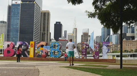 Tourists admire the iconic Brisbane sign slow motion Stock Footage