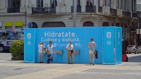 Tourists and locals getting drinking water on the Plaza Independencia Stock Footage 109508190