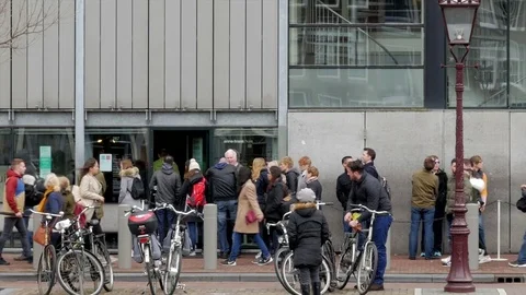 Tourists and visitors queueing to enter Anne Frank House, Amsterdam Stock Footage 74165397