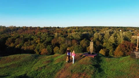 Tourists approach the edge of the mountain on which the cross stands. Stock Footage 288318541