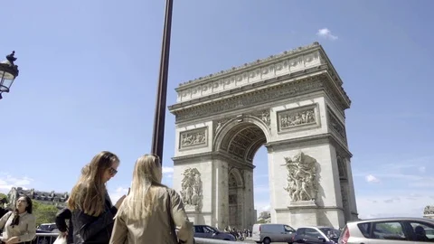 Tourists at Arc de Triomphe - two women looking at monument - Paris France 1080 Stock Footage 93814810