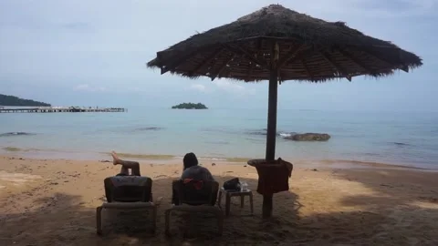 Tourists are chilling on the beach during the summer in Thailand Stock Footage 130398096