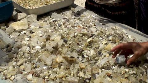 Tourists are considering raw semi-precious stones from the mine. Stock Footage 32282886
