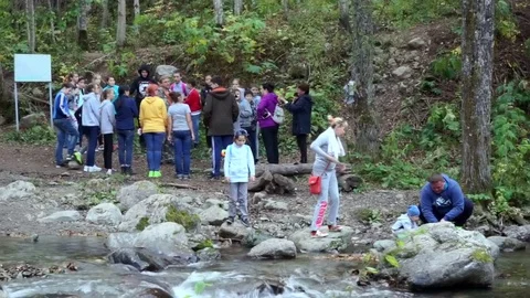 Tourists are preparing to go to the mountain Stock Footage 77705632