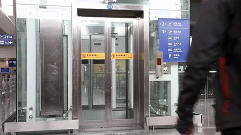 Tourists are using elevators in airport terminals. Stock Footage 87830310