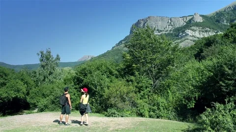 Tourists on the background of mountain rocks Stock Footage 60823581