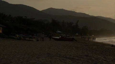 Tourists at beach during sunset Stock-Footage 88889889
