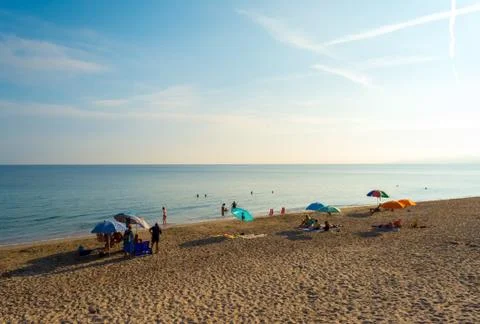 Tourists on the beach in the morning Stock Photos
