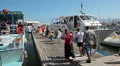Tourists boarding on cruise ship in Latchi village pier. Cyprus HD Footage