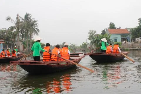 Tourists boating in the river Stock Photos