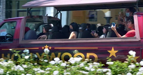 Tourists in the bus explore Rodeo Drive in Beverly Hills, Los Angeles, 4K Video stock 159056327