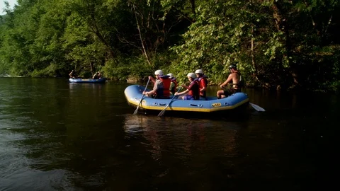 Tourists canoeing in the river Stock Footage 103793504