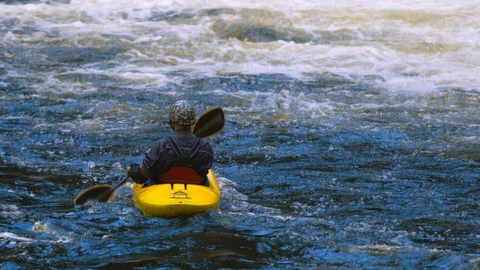 Tourists canoeing in the river Stock Footage 103823661