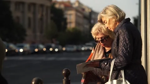 Tourists checking the city map Stock Footage 55533634