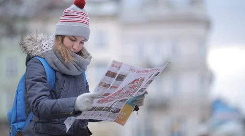 Tourists choose the direction on the map Stock Footage 57525389
