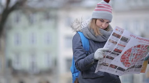 Tourists choose the direction on the map Stock Footage 57525428