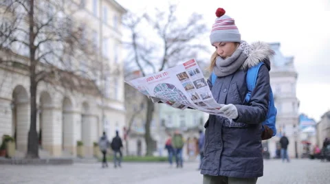 Tourists choose the direction on the map Stock Footage 57525494