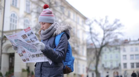 Tourists choose the direction on the map Stock Footage 57525501