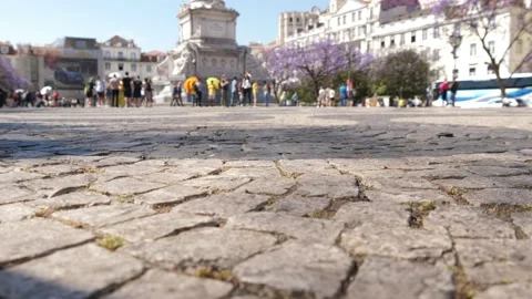 Tourists cobblestone pavement Rossio square Lisbon Portugal slow motion 4k Stock Footage 142491981