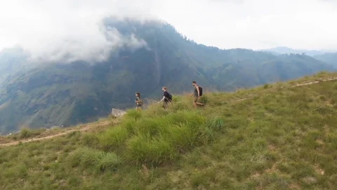 Tourists coming down from hill Stock Footage 109422544