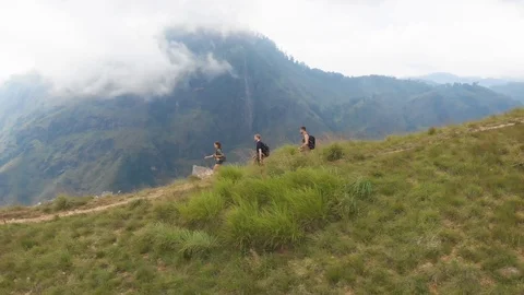 Tourists coming down from mountain Stock Footage 108721631