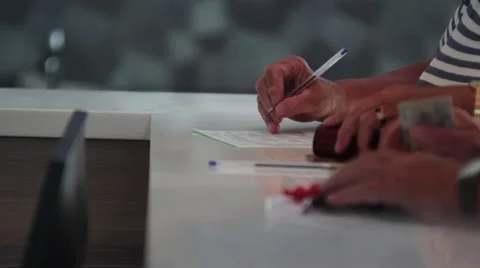 Tourists completes demand for accommodation at the hotel reception  Stock Footage 58908872