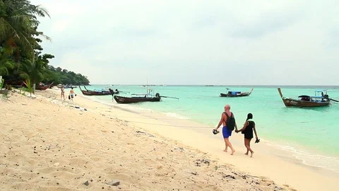 Tourists Couples Walking At Beach While Boat Docking Stock Footage 79979639