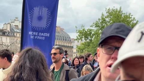 Tourists crowding the Notre Dame de Paris square Stock Footage 337783154