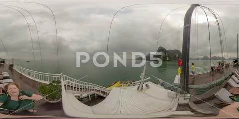 Tourists on deck of junk in Ha Long Bay Vietnam Stock Photos