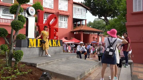 Tourists from different countries on the Dutch square in Malacca Stockbeeldmateriaal 111635527