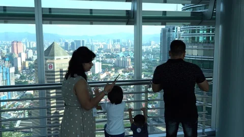 Tourists from different countries on the observation deck of the Petronas Stock Footage 111233296