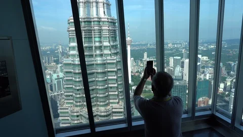 Tourists from different countries on the observation deck of the Petronas Stock Footage 111233435